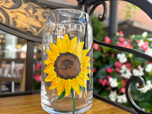 Hand-painted beer glass with sunflower painted on it