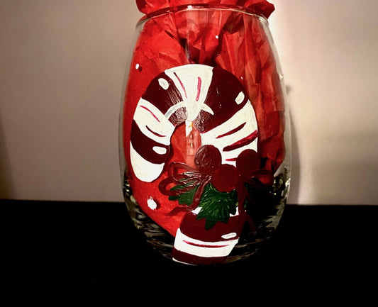 Hand-painted stemless wine glass with painted candy canes 